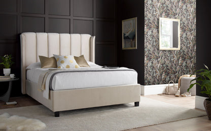 Aurora Velvet Ottoman Bed – Art Deco Winged Headboard with Foot-End Storage